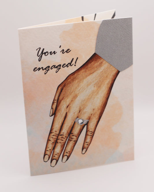 You're engaged! medium-tone female hand